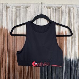 Black Ethika high neck performance style sports bra with neon pink accents